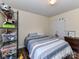 Bright bedroom features a comfortable bed, closet, and dresser with convenient storage at 3605 Truxton Ct, Waxhaw, NC 28173