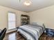 Cozy bedroom with wood-look floors, and a storage shelf for convenient organization at 3605 Truxton Ct, Waxhaw, NC 28173