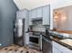 Kitchen with stainless steel appliances, modern cabinetry, mosaic tile backsplash, and black granite countertops at 3605 Truxton Ct, Waxhaw, NC 28173