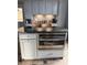 Kitchen island with granite countertop and a stainless steel GE microwave and oven combo at 3605 Truxton Ct, Waxhaw, NC 28173