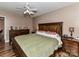 Well-lit main bedroom with a king-sized bed, wooden furniture, and hardwood floors at 3605 Truxton Ct, Waxhaw, NC 28173