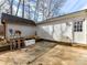 Concrete patio area with a shed and a rack of gardening tools at 3605 Truxton Ct, Waxhaw, NC 28173