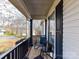 A covered porch provides a relaxing seating area with neighborhood views at 3605 Truxton Ct, Waxhaw, NC 28173