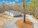 Aerial view of home with long driveway and surrounding woods at 4105 Glenola Dr, Waxhaw, NC 28173