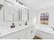 Bright bathroom featuring a double sink vanity, modern fixtures, and a soaking tub with natural light at 4105 Glenola Dr, Waxhaw, NC 28173