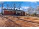 Brick ranch house with a deck and a spacious backyard at 50005 Guy Ln, Norwood, NC 28128