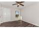 Bright bedroom with large window, hardwood floors, and double door closet at 50005 Guy Ln, Norwood, NC 28128