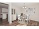 Charming dining room with white table and chairs, and hardwood floors at 50005 Guy Ln, Norwood, NC 28128