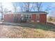 Brick ranch house with new windows, a deck, and a large yard at 50005 Guy Ln, Norwood, NC 28128