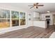 Living room with kitchen views and hardwood floors at 50005 Guy Ln, Norwood, NC 28128