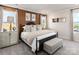 A bedroom featuring a dark metal bedframe, lots of natural light, and neutral decor at 5034 Kellaher Pl, Charlotte, NC 28216