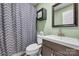 Clean bathroom with dark vanity and gray shower curtain at 603 Helms Dr, Lowell, NC 28098