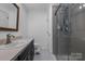 Bathroom with vanity, toilet, and a shower stall at 603 Helms Dr, Lowell, NC 28098