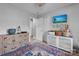 Charming bedroom with dresser, rug, and decorative plates at 603 Helms Dr, Lowell, NC 28098