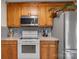 View of kitchen stove, microwave and cabinets at 603 Helms Dr, Lowell, NC 28098