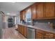 Kitchen with wood cabinets, tile backsplash, and stainless steel appliances at 603 Helms Dr, Lowell, NC 28098