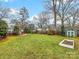 Large backyard with a shed, garden, and expansive lawn at 6716 Ronda Ave, Charlotte, NC 28211