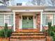 Brick front entrance with double doors, flanked by columns and greenery at 6716 Ronda Ave, Charlotte, NC 28211