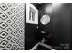 Small bathroom with black walls and a black vessel sink at 7117 W Sugar Creek Rd, Charlotte, NC 28269