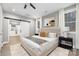 Main bedroom with barn door, plush bed, and neutral decor at 7117 W Sugar Creek Rd, Charlotte, NC 28269