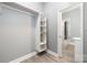 Walk-in closet with built-in shelving and rod at 7117 W Sugar Creek Rd, Charlotte, NC 28269