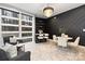 Modern dining area with marble floors, statement wall, and chandelier at 7117 W Sugar Creek Rd, Charlotte, NC 28269