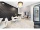 Open concept dining area with marble floors and modern lighting at 7117 W Sugar Creek Rd, Charlotte, NC 28269