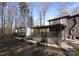 Modern home with a covered patio and a walkway leading to the entrance at 7117 W Sugar Creek Rd, Charlotte, NC 28269