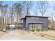 Modern two-story home with gray siding, attached carport and landscaping at 7117 W Sugar Creek Rd, Charlotte, NC 28269