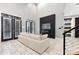 Bright living room with white sofa, fireplace, and large windows at 7117 W Sugar Creek Rd, Charlotte, NC 28269