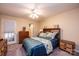 Cozy bedroom with carpet, a ceiling fan, and furnishings at 749 21St Ne Ave, Hickory, NC 28601