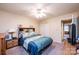 This is a well-lit bedroom with a bed, carpet, and ceiling fan at 749 21St Ne Ave, Hickory, NC 28601