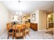 Dining room with a wooden table set and a view of the living room with fireplace and sofa at 749 21St Ne Ave, Hickory, NC 28601