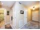 Hallway with tile flooring, multiple doors, and neutral paint leading to various rooms in the home at 749 21St Ne Ave, Hickory, NC 28601