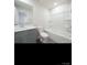 Bathroom with gray vanity, toilet and bathtub with shower at 800 Parkette St, Concord, NC 28027