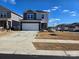 Two-story house with gray and beige siding, a two-car garage, and a landscaped yard at 800 Parkette St, Concord, NC 28027