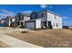 Two-story house with gray and beige siding, a two-car garage, and a landscaped yard at 800 Parkette St, Concord, NC 28027