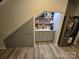 Under-stair wet bar with shelving and cabinets for storage and drinks at 800 Parkette St, Concord, NC 28027