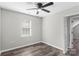 Bedroom with ceiling fan and large window at 8018 Trotter Rd, Charlotte, NC 28216