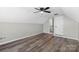 Spacious bedroom with ceiling fan and gray walls at 8018 Trotter Rd, Charlotte, NC 28216