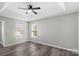 Bright bedroom with wood-look flooring and ceiling fan at 8018 Trotter Rd, Charlotte, NC 28216