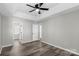 Bright bedroom with ceiling fan and wood-look flooring at 8018 Trotter Rd, Charlotte, NC 28216