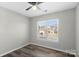 Spacious bedroom with double window and ceiling fan at 8018 Trotter Rd, Charlotte, NC 28216