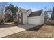 Side view of house with attached garage and driveway at 8018 Trotter Rd, Charlotte, NC 28216