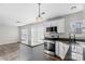 Modern kitchen island with granite countertops and stainless steel appliances at 8018 Trotter Rd, Charlotte, NC 28216