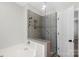 Modern shower with glass enclosure and tile at 8018 Trotter Rd, Charlotte, NC 28216