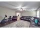 Finished basement includes a sectional sofa, a home gym, and access to other rooms at 8100 Avanti Dr, Waxhaw, NC 28173