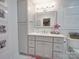 Modern bathroom with gray vanity, white countertop, and mosaic tile floor at 8100 Avanti Dr, Waxhaw, NC 28173