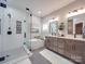 Elegant bathroom featuring double vanity and walk-in shower at 8100 Avanti Dr, Waxhaw, NC 28173