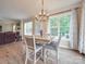 Bright breakfast nook features a table with chairs, and access to backyard at 8100 Avanti Dr, Waxhaw, NC 28173